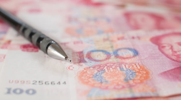 pen on top of chinese money