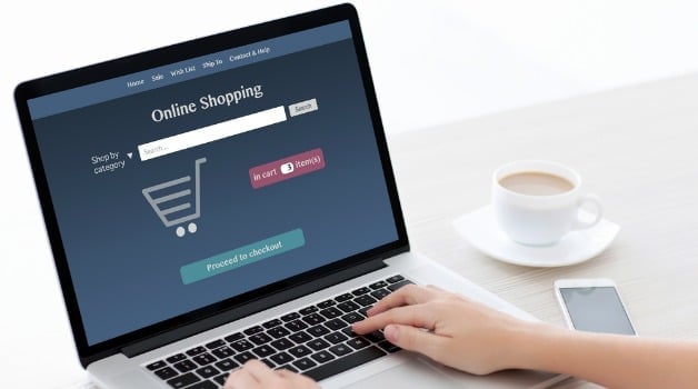 online shopping site open on laptop on desk
