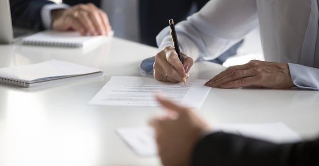 Man filling in bank documents