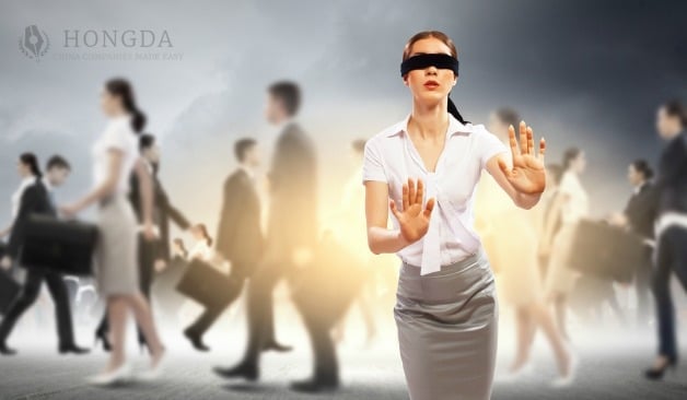 businesswoman in a crowd with a blindfold