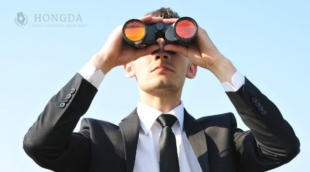 man through binoculars 