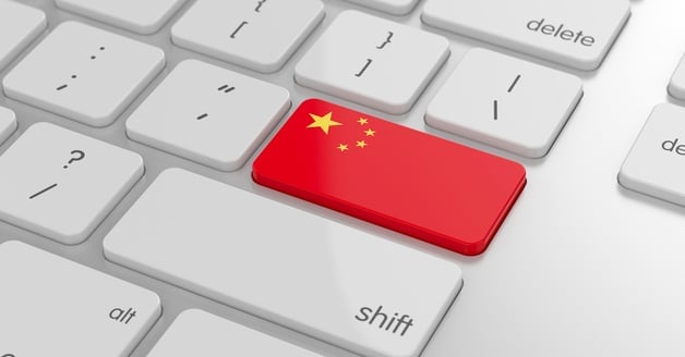 Flag of China on a computer keyboard, depicting online buying